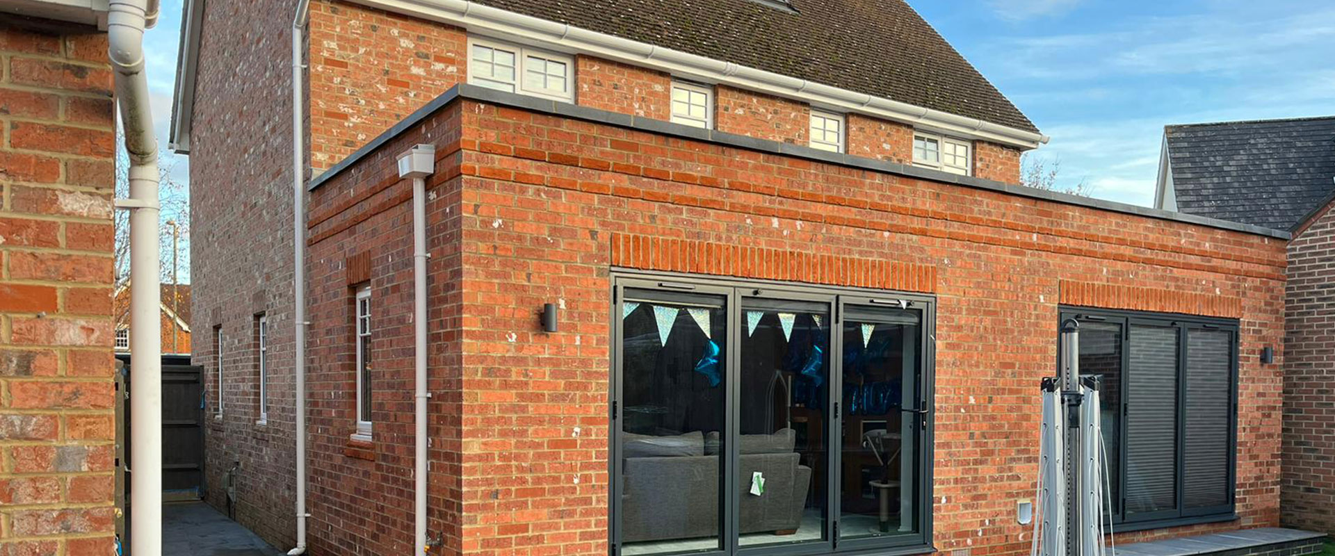 Brickwork and a finished elevation on a house of the kind we work on in Aldermaston
