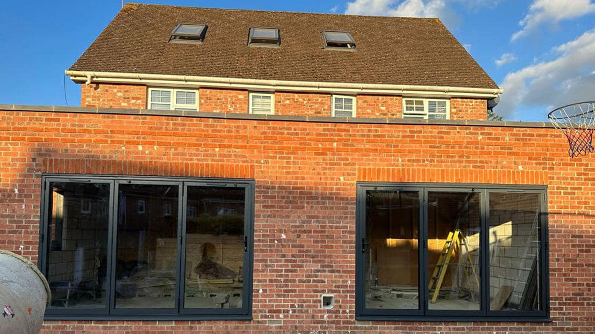 A brick extension with large glazed openings, built by Shape Create & Build